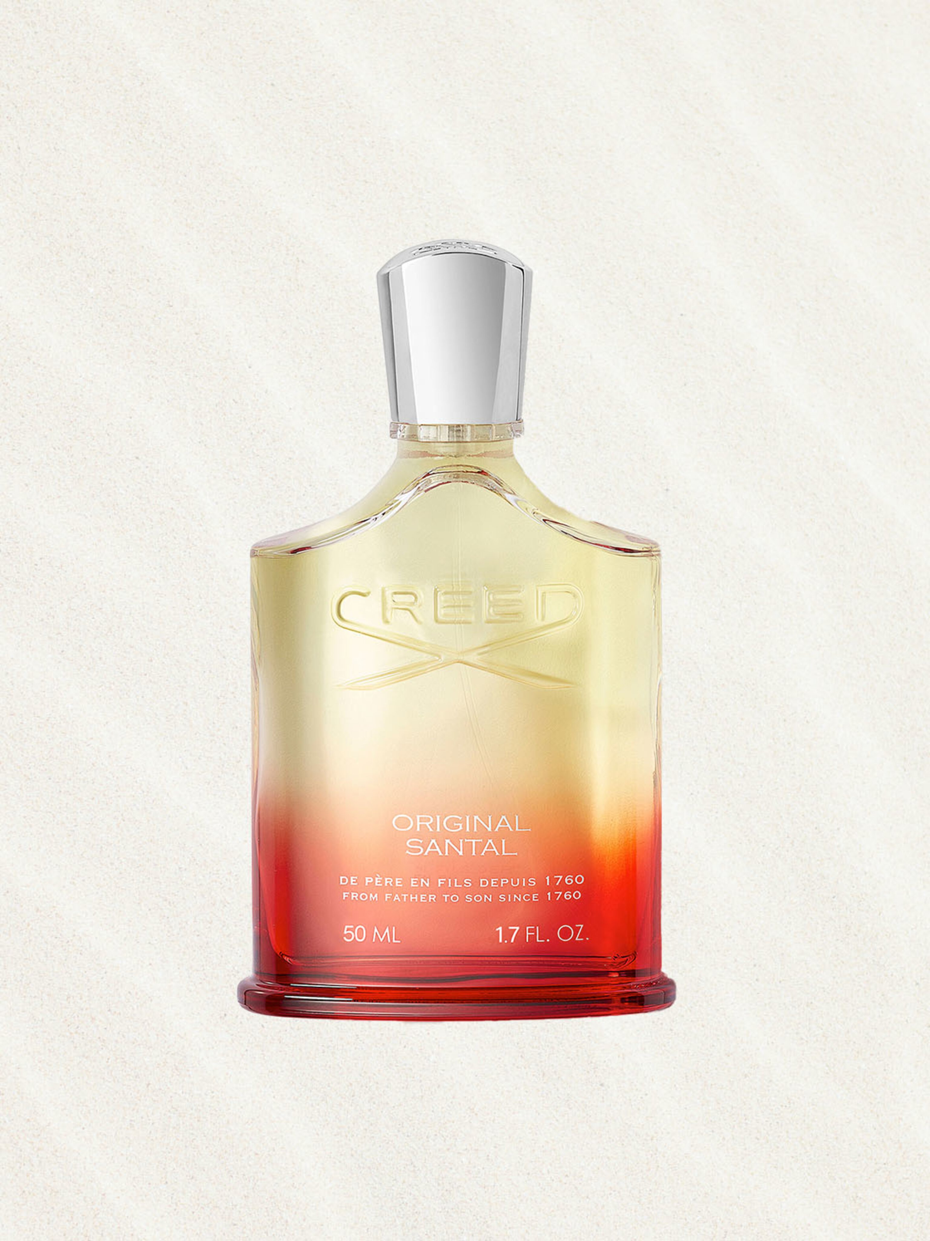 Creed Original Santal fragrance in a red and yellow glass bottle